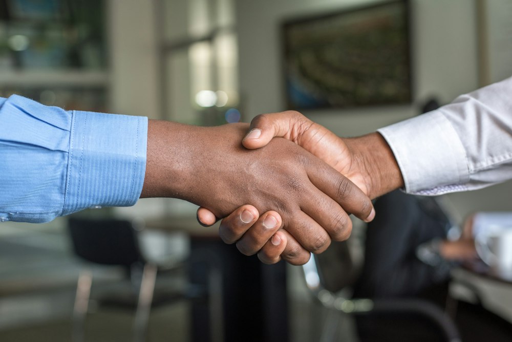 Handshake after successful Hong Kong deal