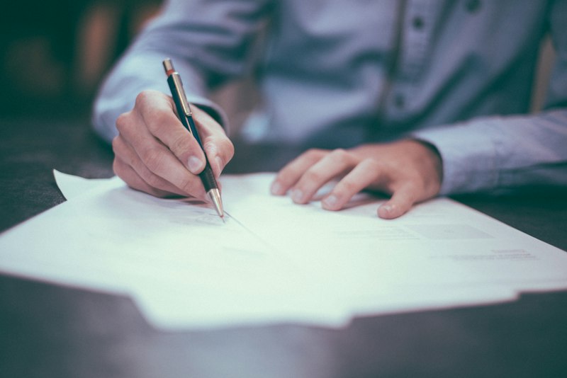Signing legal documents in Hong Kong